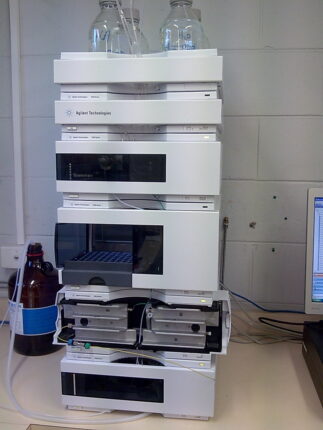 A photo of an HPLC stack to illustrate the need for analytical method validation processes and accompanying software