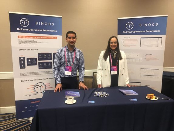 A photo of Akshay Peer and Swapna Patel manning the Binocs booth at the Lab of the Future 2022 event