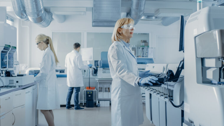 Laboratory analysts working in a modern lab